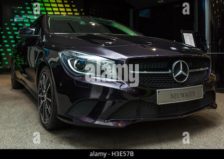 BERLIN - NOVEMBER 03, 2013: Showroom. Compact executive car Mercedes-Benz CLA 180 Coupe. Produced since 2013. Stock Photo