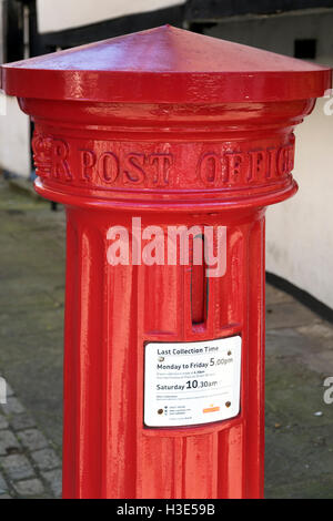 Cylindrical letter box with upright slot in Eton Berkshire Stock Photo