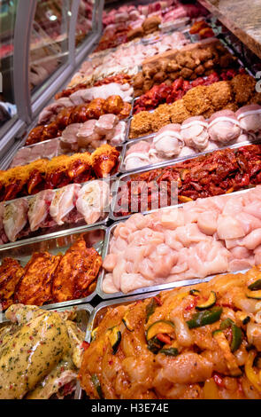 Variety of marinated meat at display counter Stock Photo