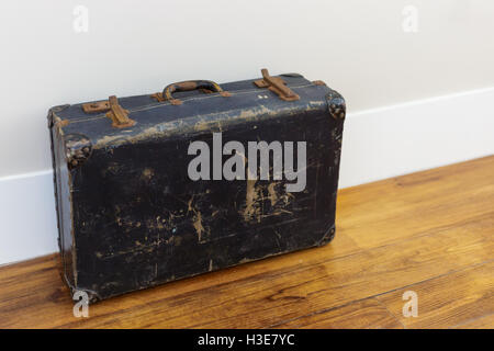 Vintage suitcase on the floor Stock Photo
