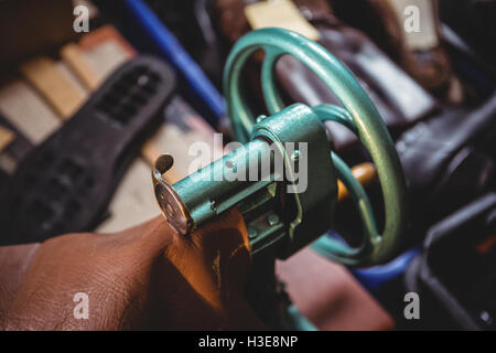Shoemaker using sewing machine Stock Photo