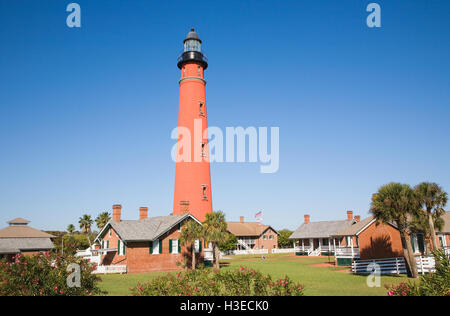 The 175 foot orange masonry tower of Ponce de Leon Inlet Lighthouse is the tallest in Florida, once called Mosquito Inlet Light. Stock Photo