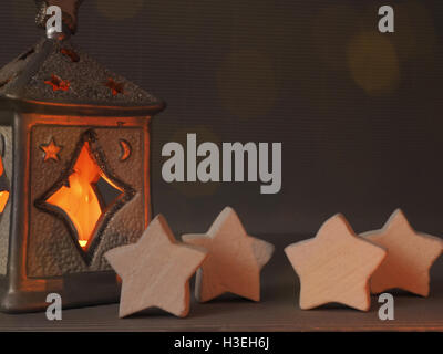 Christmas background with star shapes and candle lights Stock Photo