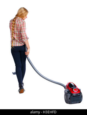 Rear view of a woman with a vacuum cleaner. She is busy cleaning. Rear view people collection. backside view of person. Isolated over white background. Long-haired blonde vacuums. Stock Photo
