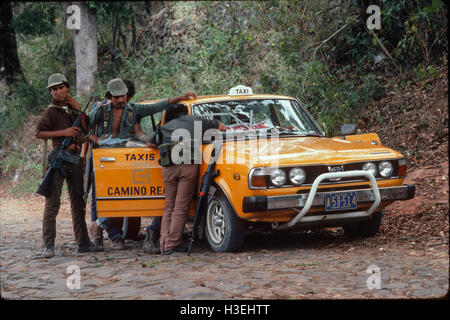 TENANCINGO,  EL SALVADOR, MARCH 1984: - Within the FPL Guerrilla's Zones of Control.  A taxi from San Salvador brings a passenger into the contested town. Stock Photo