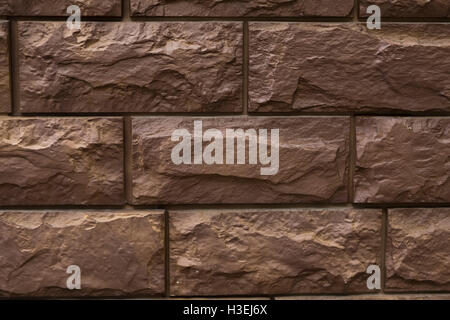 Wall external finish of the blocks and bricks country house Stock Photo