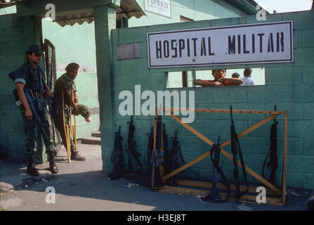 SAN SALVADOR, EL SALVADOR, MAY 1986: A Salvadoran soldier who has had a foot blown off by a mine prepares to leave the military hospital.   The F.M.L.N. guerillas are making increasing use of home-made plastic mines.   Photo by Mike Goldwater Stock Photo