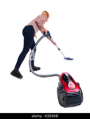 Rear view of a woman with  vacuum cleaner Stock Photo