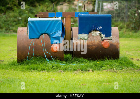 Rugby scrum machine from front. Old and rusty Rugby scrummage training device on pitch near Bath, in Somerset, UK Stock Photo