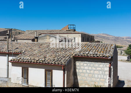 Ancient Sicilian rural architecture. Roofs with old clay tiles. All uninhabited houses. Old buildings. The places of Montalbano, Stock Photo