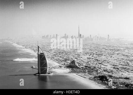Dubai, United Arab Emirates - October 17, 2014: The famous Burj Al Arab hotel and Dubai skyline taken from a seaplane in black a