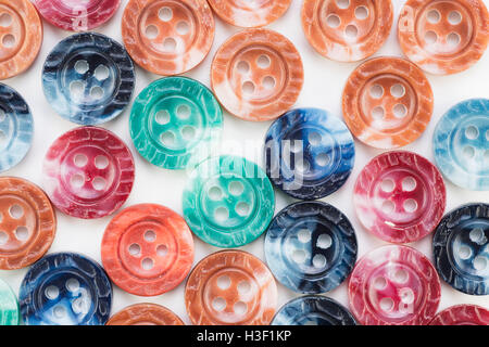 Colorful button texture with red, blue, green and orange tones. Stock Photo