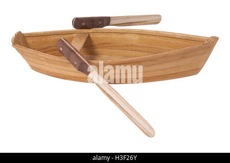 Wooden row boat with two toned wooden oars - path included Stock Photo