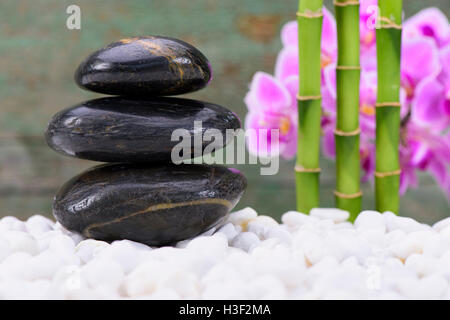 Japanese Zen garden with stacked stones mirroring in water Stock