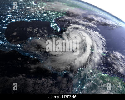 Satellite view of night over America with masive hurricane in Caribbean. 3D illustration. Elements of this image furnished by NA Stock Photo