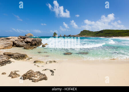 Beach at Anse des Châteaux and the rocks of Pointe des Colibris, easternmost point of Grande-Terre, Guadeloupe Stock Photo