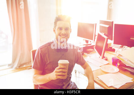 happy creative male office worker drinking coffee Stock Photo