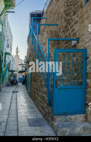ACRE, ISRAEL - OCTOBER 01, 2015: Alley scene in the old city, with locals at a cafe, in Acre, Israel Stock Photo