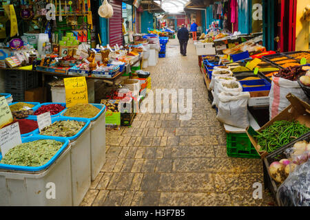 ACRE, ISRAEL - JANUARY 18, 2016: Market scene in the old city, with sellers and shoppers, in Acre, Israel Stock Photo