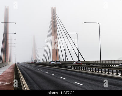 Cars in the fog. Bad weather and dangerous automobile traffic on the road. Stock Photo