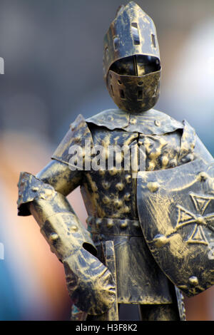 Close-Up of Miniature Bronzed Knight in Full Armour, Sword and Shield at Hell's Kitchen Flea Market Manhattan NYC New York Stock Photo