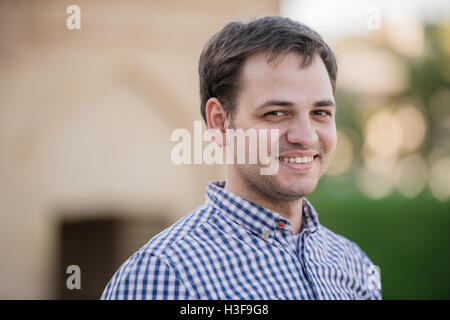 Portrait of young happy smiling man, outdoors Stock Photo