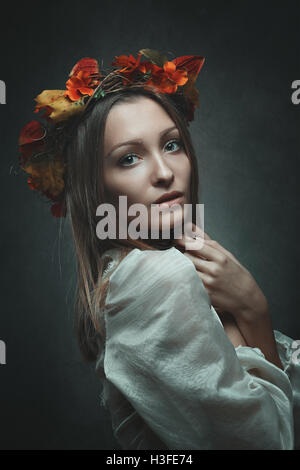 studio portrait of autumn woman in yellow leaves Stock Photo - Alamy