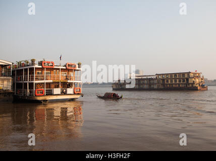 traditional French Colonial riverboats in Phnom Penh habour. Stock Photo