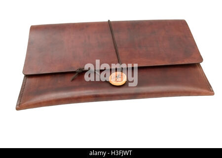Dark brown leather document Wallet with leather tie. Isolated against a white background. Stock Photo