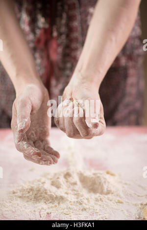 Close up of a woman working with flour Stock Photo