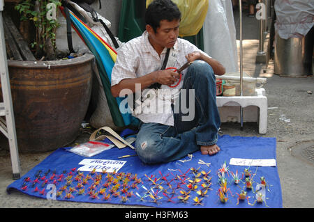 Straw folding craftsman Bangkok Stock Photo