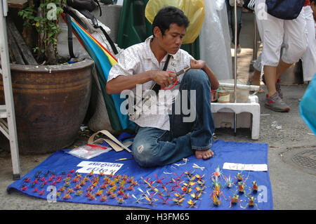 Straw folding craftsman Bangkok Stock Photo