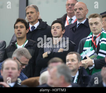 Rory McIlroy (centre) watches from the stands during the 2018 FIFA World Cup Qualifying match at Windsor Park, Belfast. Stock Photo