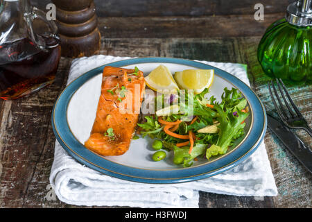 Barbecue maple glazed salmon with fresh salad Stock Photo