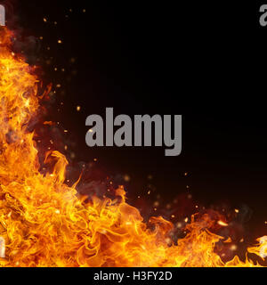Abstract fire flames background with free space for text. Isolated on black Stock Photo