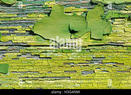 Old Green Cracked Paint on Wood Close Up. Abstract Texture Background. Stock Photo
