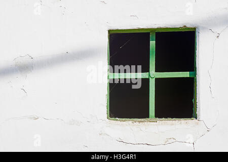Old Green Window on Cracked Wall Stock Photo