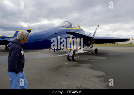 U.S. Secretary of State John Kerry looks at an F/A-18 fighter jet used by the Blue Angels, the U.S. Navy's flight demonstration team, as he stopped at Joint Base Elmendorf-Richardson on July 27, 2016, for an aircraft re-fueling while the team was in town to perform at the upcoming Arctic Thunder air show. Stock Photo