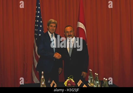 U.S. Secretary of State John Kerry shakes hands with Turkish Foreign Minister Mevlut Cavusoglu before a bilateral meeting in Hangzhou, China on September 3, 2016. Stock Photo