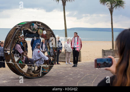 Bournemouth, Dorset, UK. 8th Oct, 2016. Bournemouth Arts by the Sea Festival returns for a sixth year with festival entertainment. Wheelhouse by Acrojou a ‘tender, post-apocalyptic love story', The Wheel House is a unique, rolling acrobatic-theatre show, which unfolds inside and around a stunning circular home as it travels with the audience walking alongside. The Wheel House is Acrojou's flagship show, a performance that has captured the hearts and imaginations of audiences around the world. Credit:  Carolyn Jenkins/Alamy Live News Stock Photo