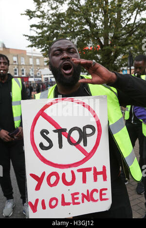 London, UK. 8th Oct, 2016. A man chants during march from Brixton to Tulse Hill denouncing knife and Gun crime. Credit:  Thabo Jaiyesimi/Alamy Live News Stock Photo