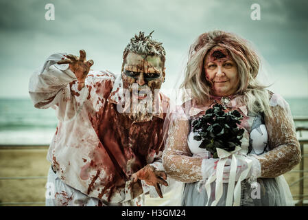 Sitges, Spain. October 9th, 2016. A couple dressed as a zombie bridal pair is seen on the beach before taking part in the Sitges Zombie Walk 2016 Credit:  matthi/Alamy Live News Stock Photo