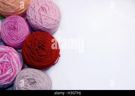 Balls of wool cotton silk yarn set on copy space white background on right Stock Photo