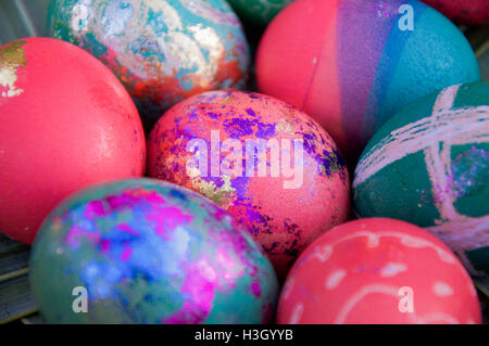 Closeup of colorfully dyed eggs with metallic accents in full frame detail. Stock Photo