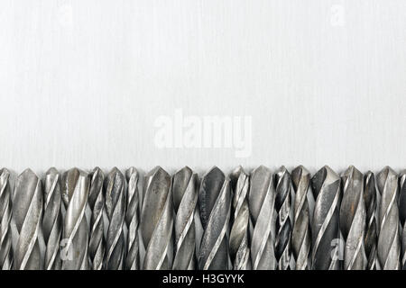 Various used metal drill bits in a row Stock Photo