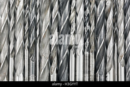 Various used metal drill bits pattern background Stock Photo