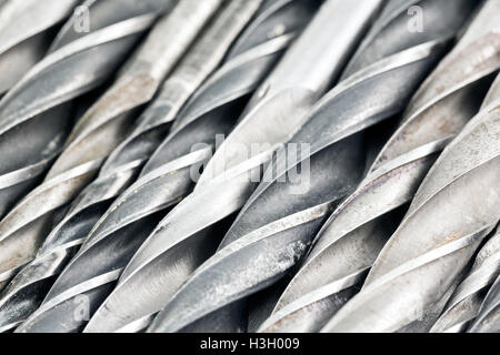 Various used metal drill bits pattern background Stock Photo