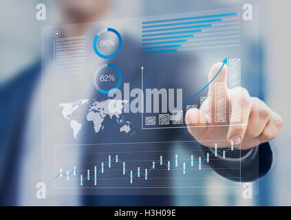 Businessman touching financial dashboard with key performance indicators Stock Photo