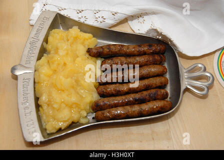 The famous finger-thin Nuremberg Bratwurst (Nuremberg sausage) served at Restaurant Bratwurstglocklein ( English: Sausage Bells restaurant ) in the me Stock Photo