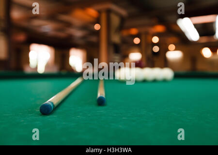 Billiard balls and pool sticks Stock Photo